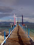 The pier with its colourful flags as Gangga Island Resort and Spa, Sulawesi